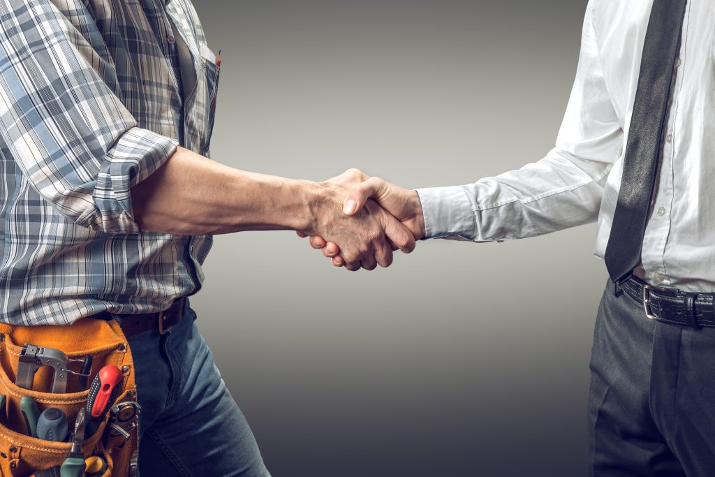 Contractor and person shaking hands